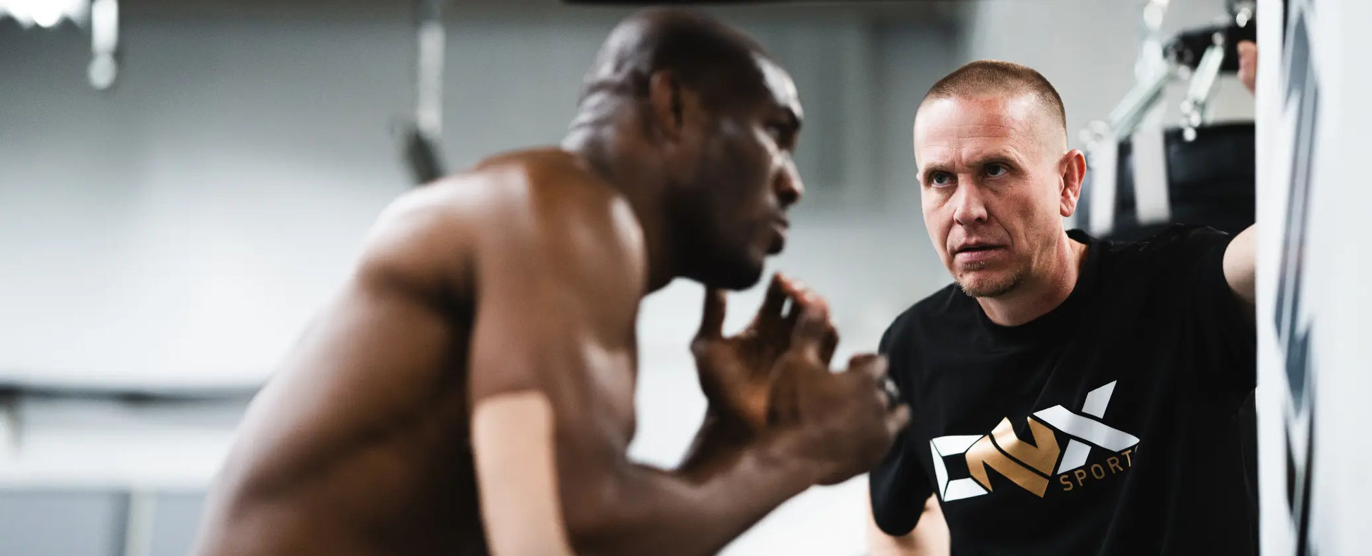 UFC fighter Kamaru Usman training with ONX gloves and Trevor Wittman.