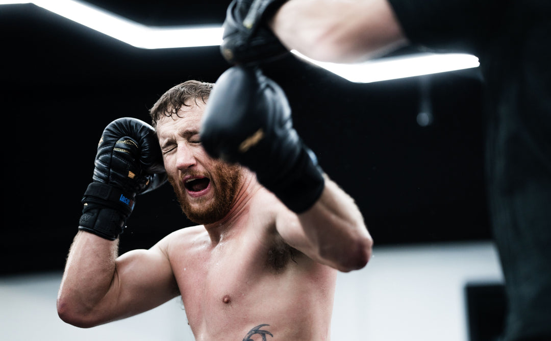 Justin Gaethje training with Trevor Wittman at the ONX gym with ONX gloves.