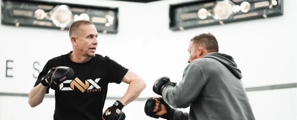 UFC fighter Justin Gaethje training with ONX gloves and Trevor Wittman.
