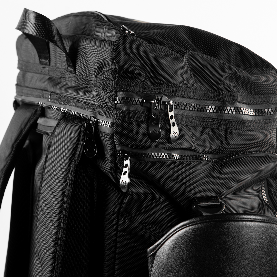 Close-up of the ONAX black backpack with zippers on a white background.