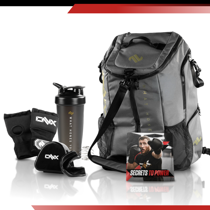ONX Fight Kit bundle including duffle bag, shaker, hand wraps, and mouthguard arranged together on a neutral
background