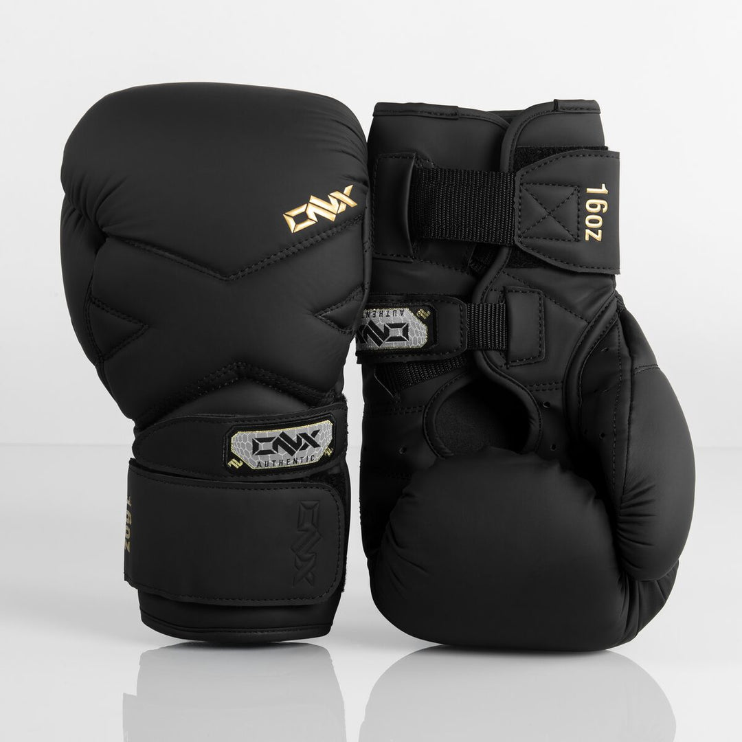 Pair of black ONX Precision Line X-Factor Gloves showing the front knuckle design, wrist strap and 16oz label