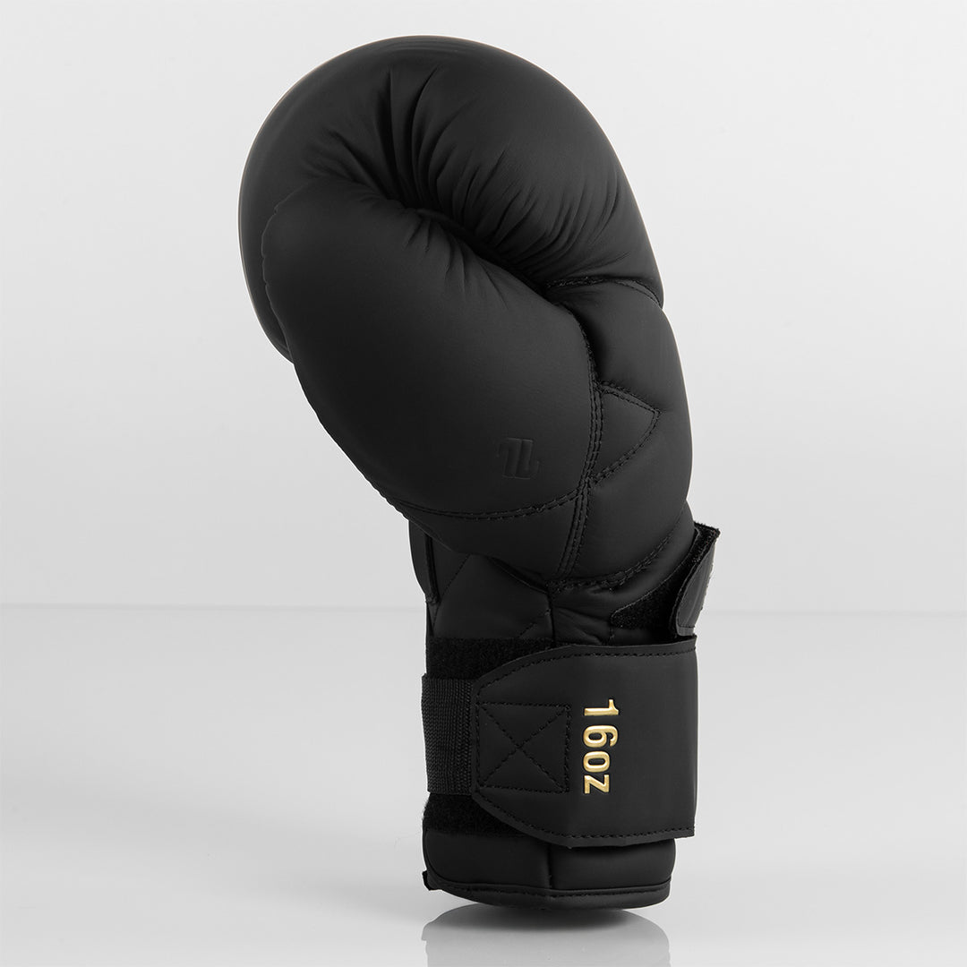 Side profile of a black ONX Precision Line X-Factor Glove with 16oz label on the wrist strap