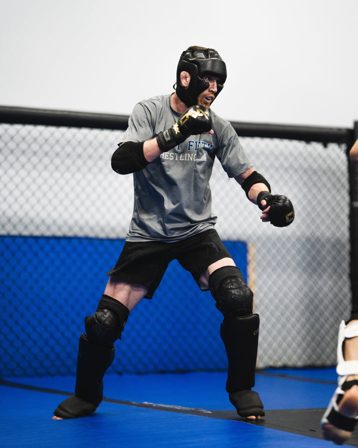 Cory Sandhagen training in ONX shin gear, head gear, and gloves